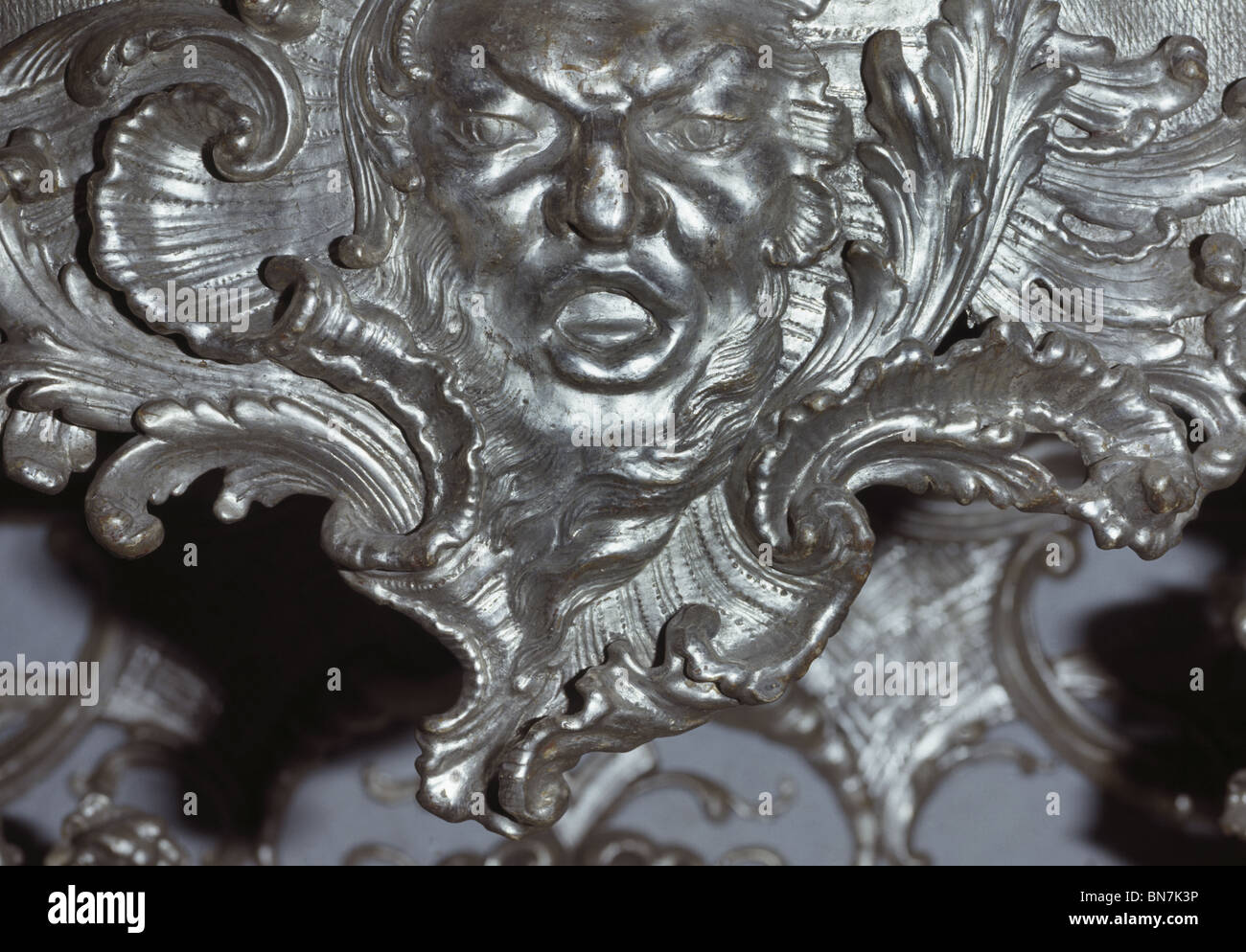 Silver gilt mask, detail  of rococo console table 1739 by Francois de Cuvillies (1695-1768) in the Spiegelsaal, Amalienburg. Stock Photo