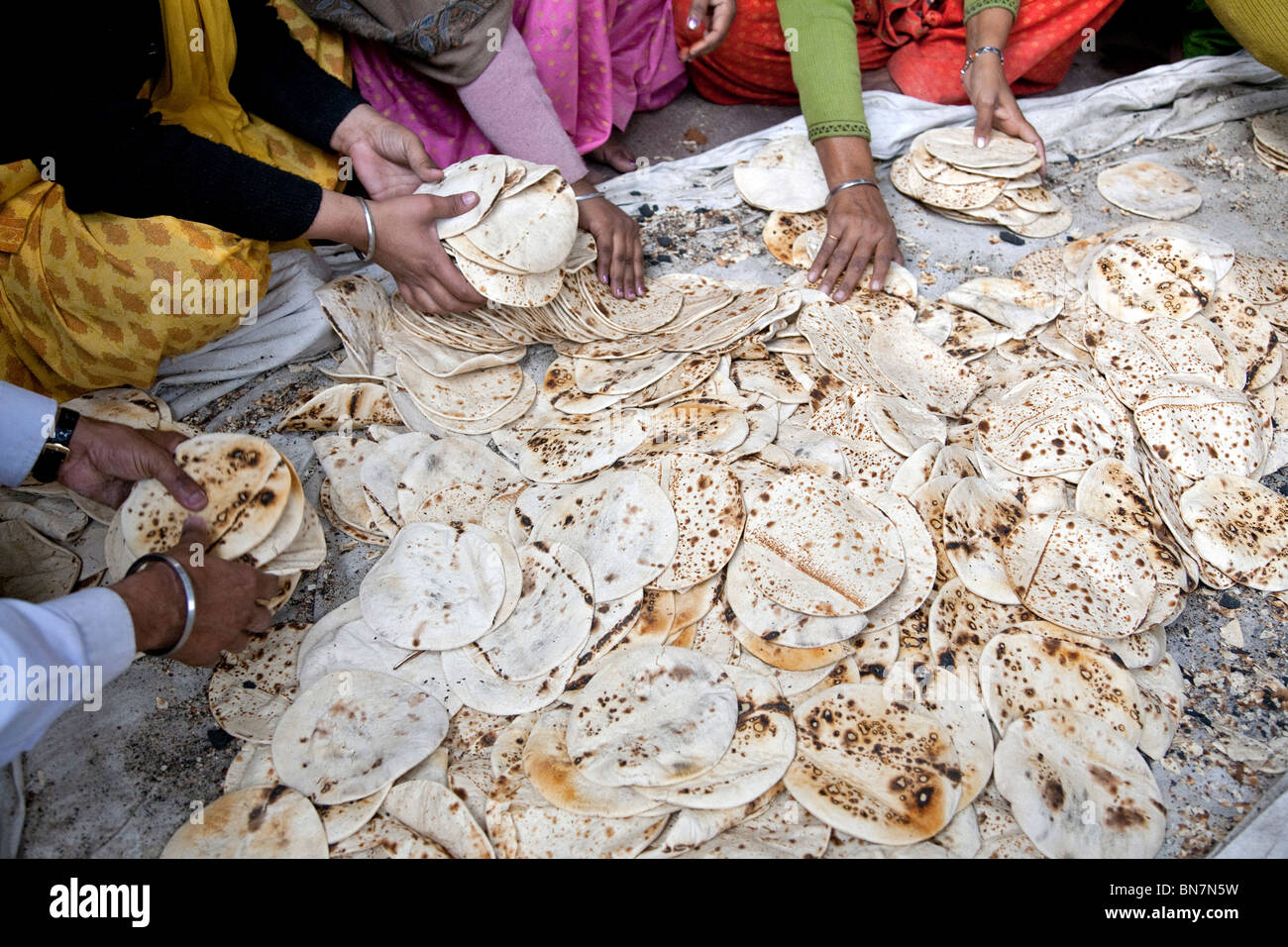 Pile of chapatis (Indian bread) for the pilgrims. The Golden temple. Amritsar. India Stock Photo
