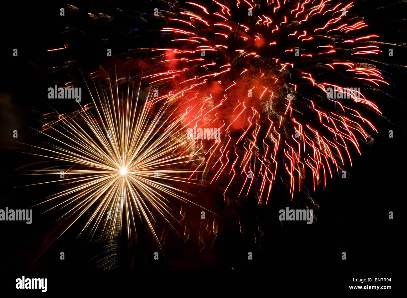 Multiple bursts of fireworks light up the night sky on the Fourth of 