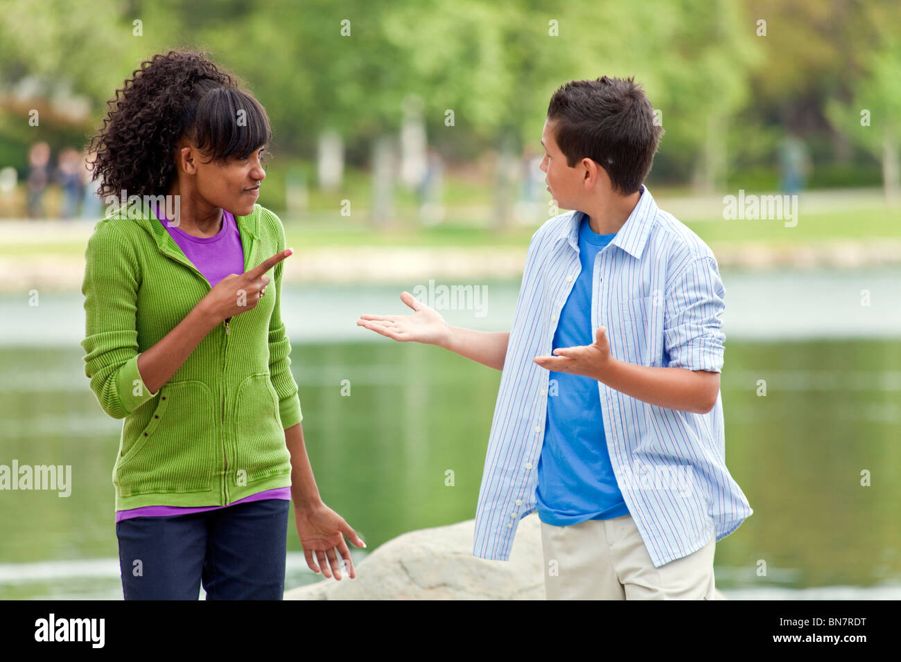 Multi ethnic racial racially diverse 14 15 16 year old Girl boy discuss discussion debate team young person people nature,natural animated  © Myrleen Pearson Stock Photo