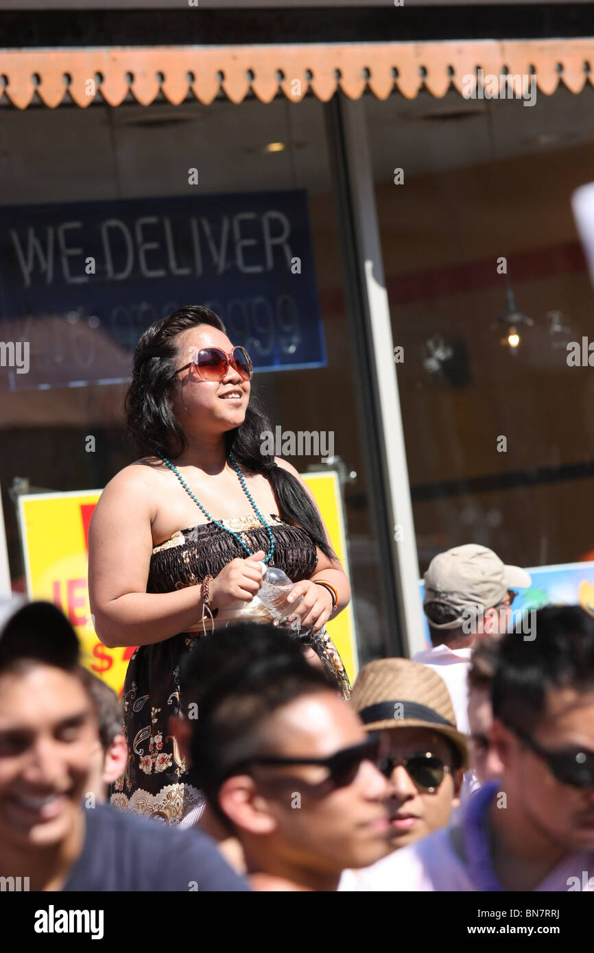 Hispanic fat woman sunglasses crowd Stock Photo