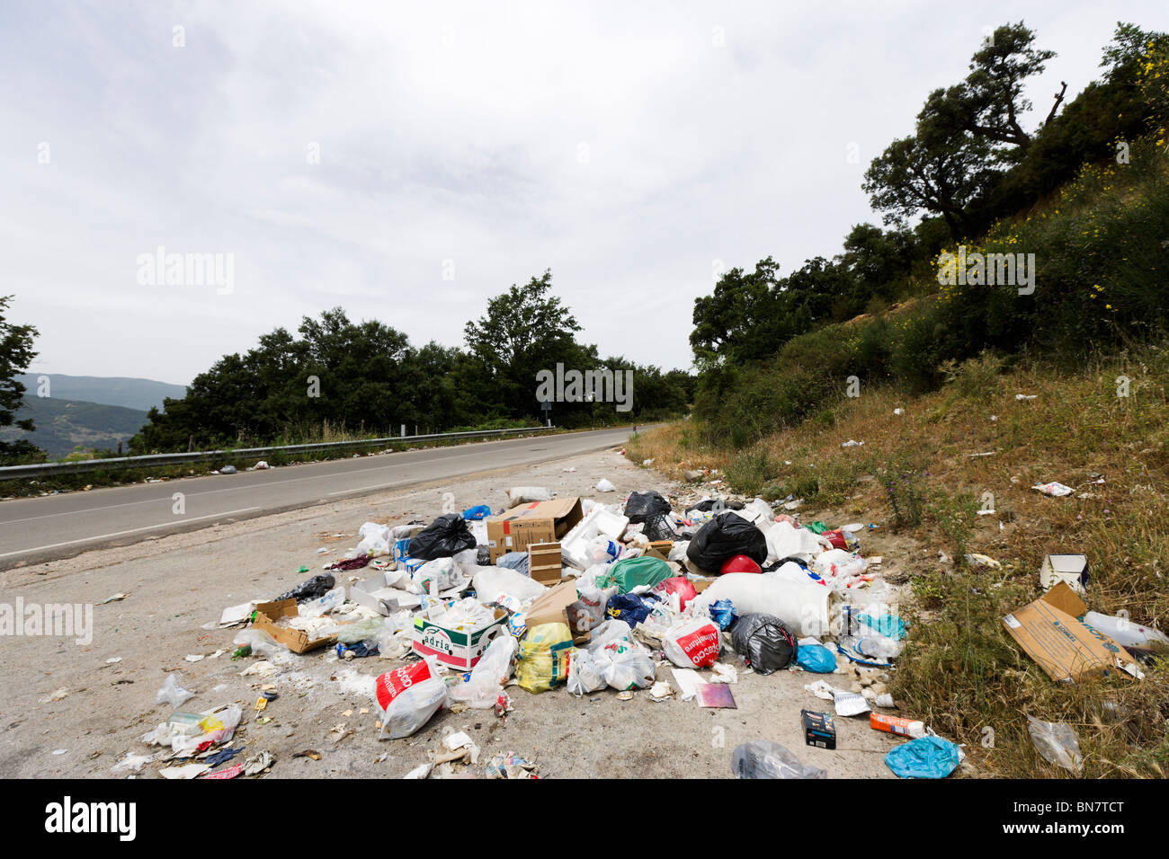 Fly tipping in a layby on the SS 289 in the Parco dei Nebrodi National Park, Sicily, Italy Stock Photo