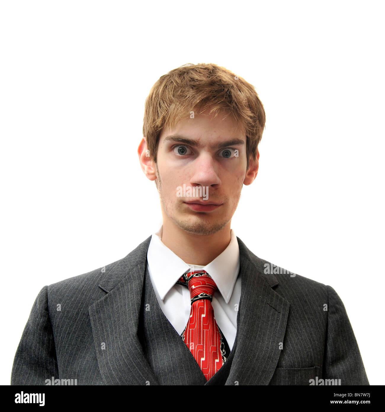 Serious unemotional man in suit isolated on white background. Cold