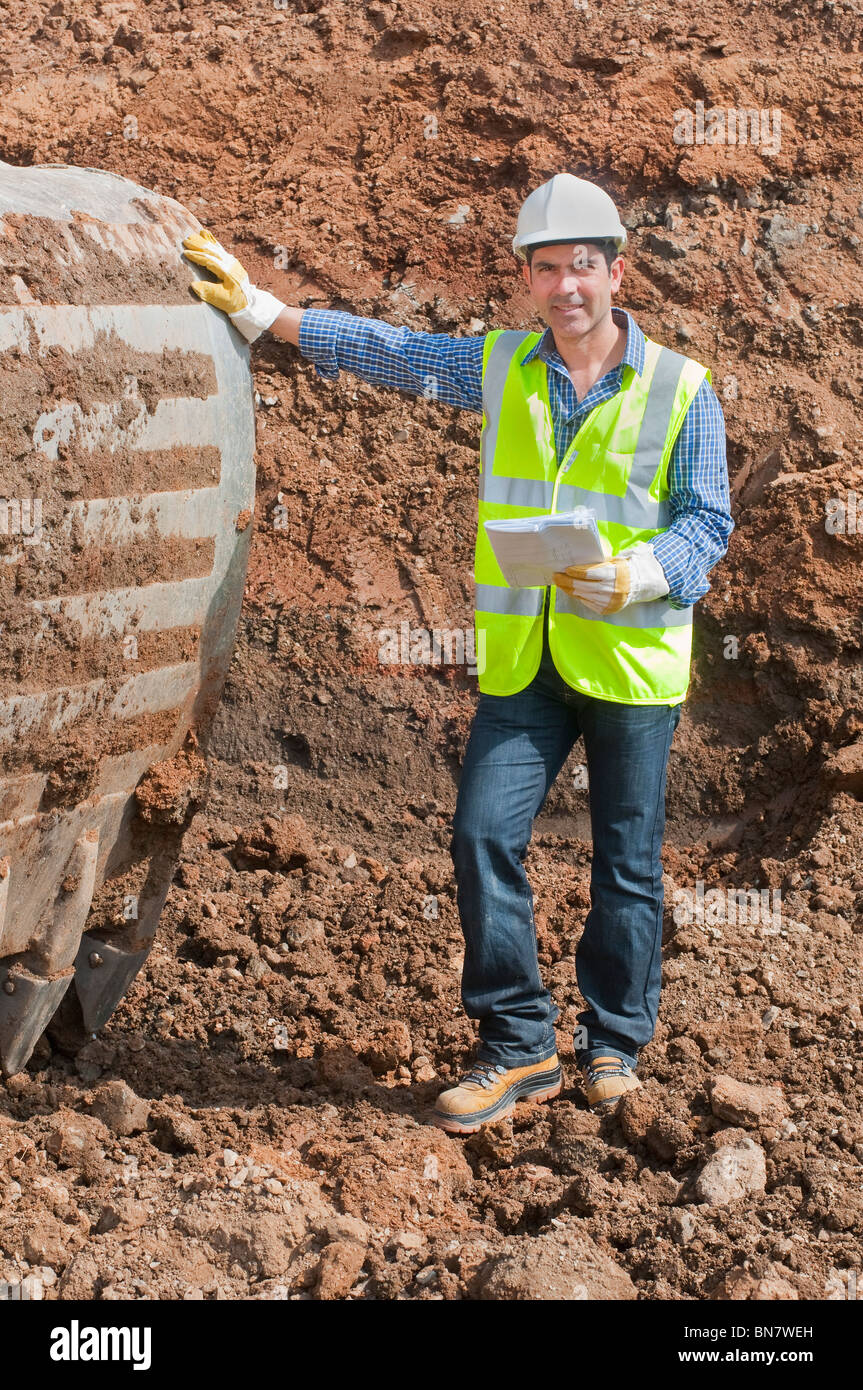 Hispanic construction worker standing in dirt Stock Photo