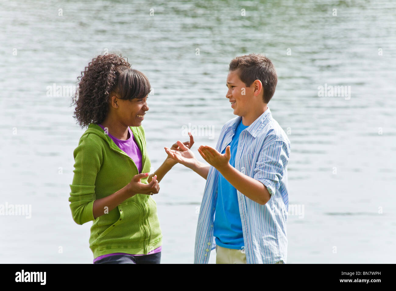 California Multi ethnic racial Ethnically diverse group teenagers African American teens having enthusiastic conversation MR  ©Myrleen Pearson Stock Photo