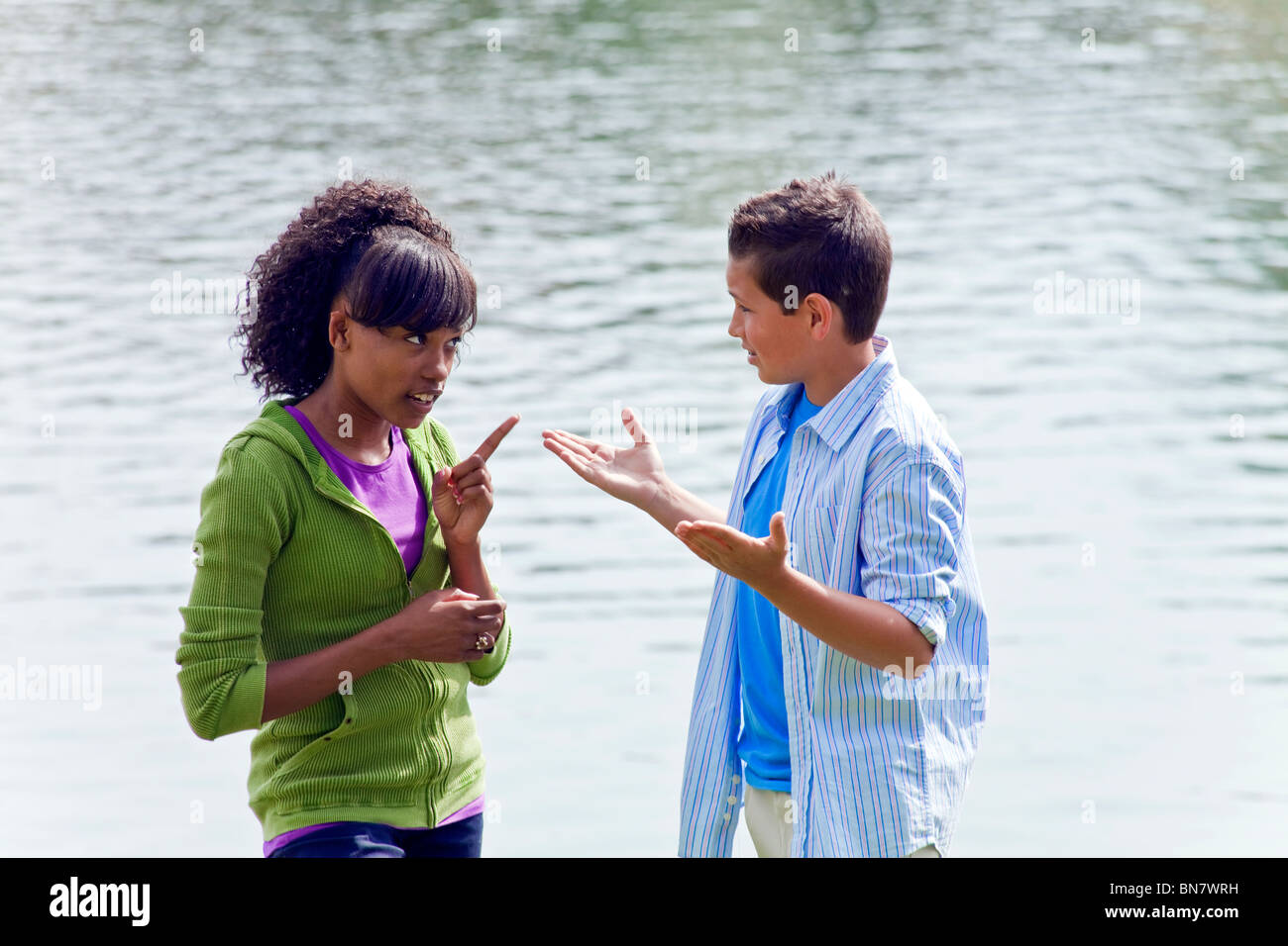 14 15 16 year years old Multi ethnic racial Ethnically diverse teenagers African American Caucasian talking enthusiastic conversation MR ©Myrleen Pearson Stock Photo