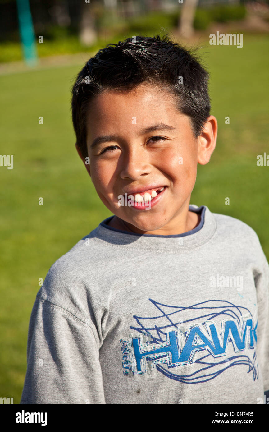 9 -11 year old Hispanic boy smiling front view looking at camera tween tweens .  MR  © Myrleen Pearson Stock Photo