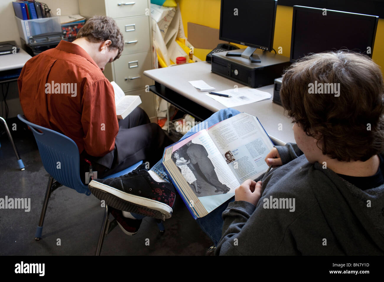 High school boys read in class during mandatory 30-minute reading break. Stock Photo