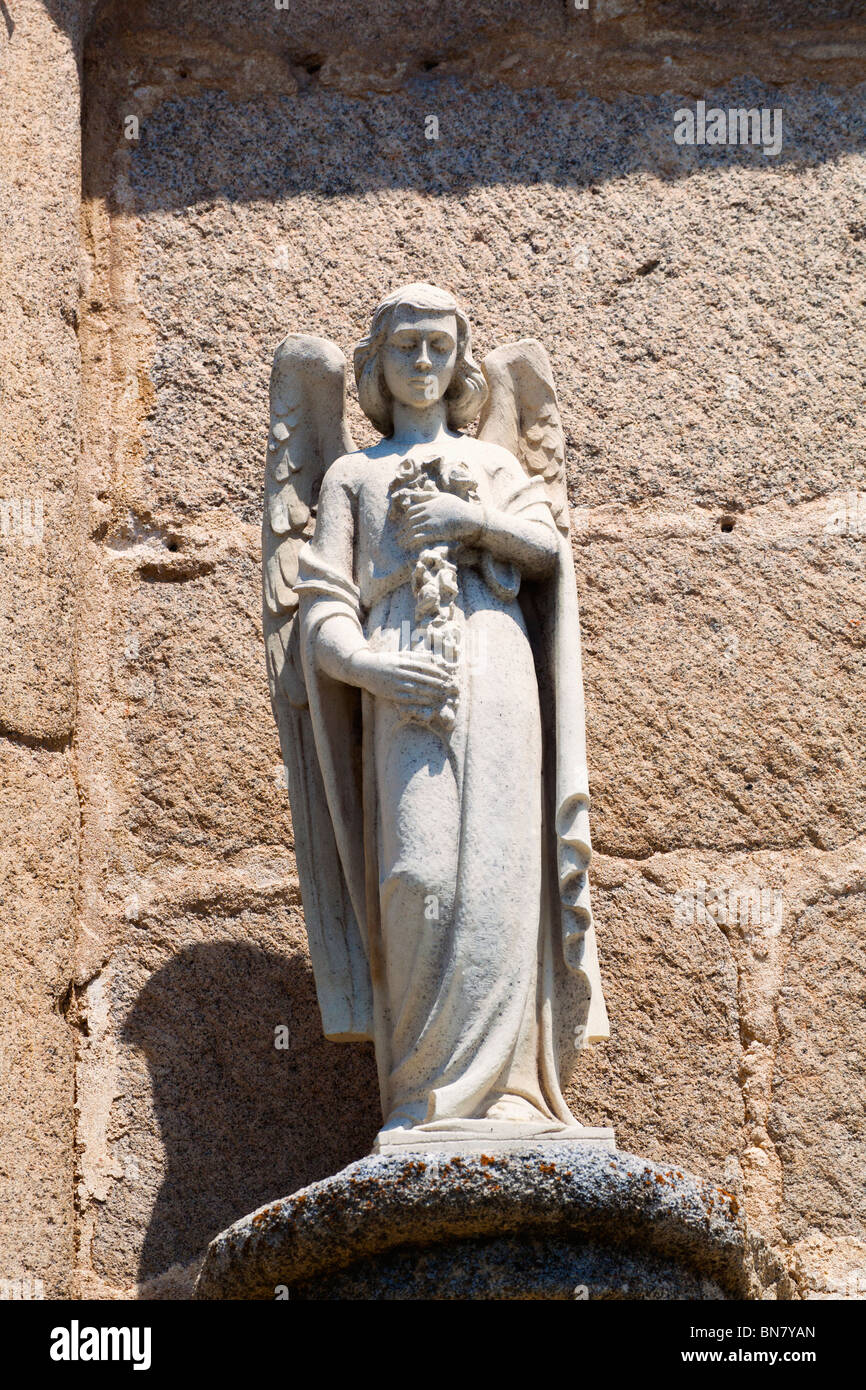 Avila, Avila Province, Spain. Statue of angel on wall of 15th century Convent of the Encarnación
