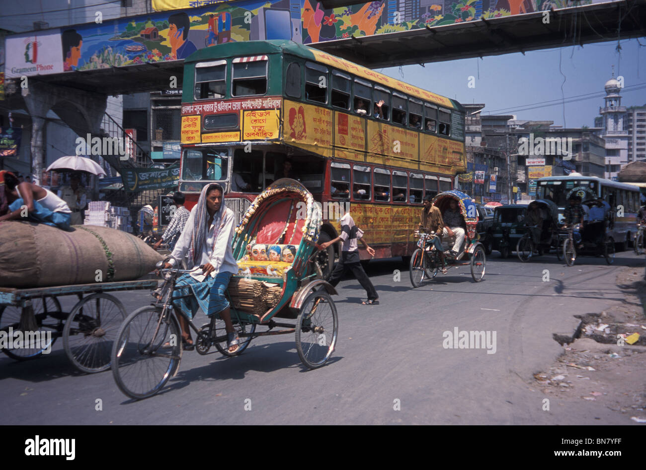 Double Decker in Dhaka – Colourful modes of transport on the roads of Bangladesh. Stock Photo