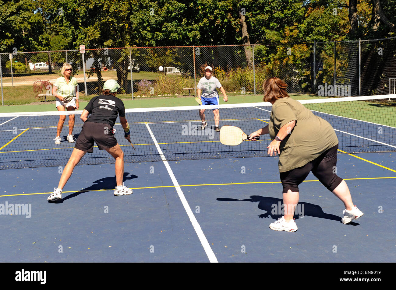 Pickleball is a tennis like sport played by people of all ages Stock