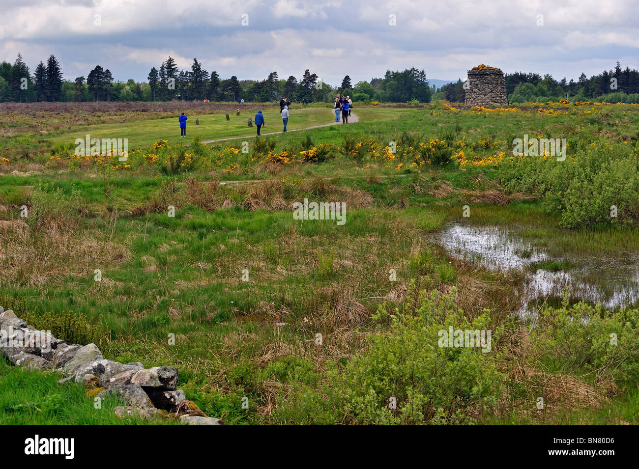 Tourists visiting the moor with its memorial cairn at the Culloden