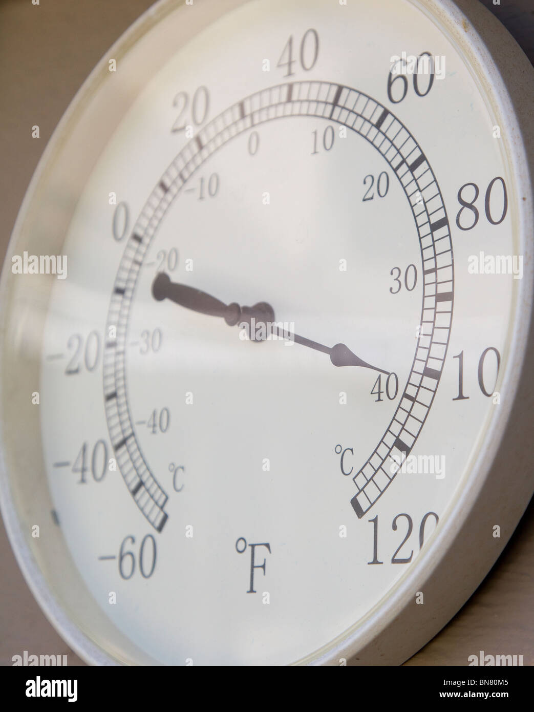 Outdoor thermometer showing 100 degree Fahrenheit temperature Stock Photo