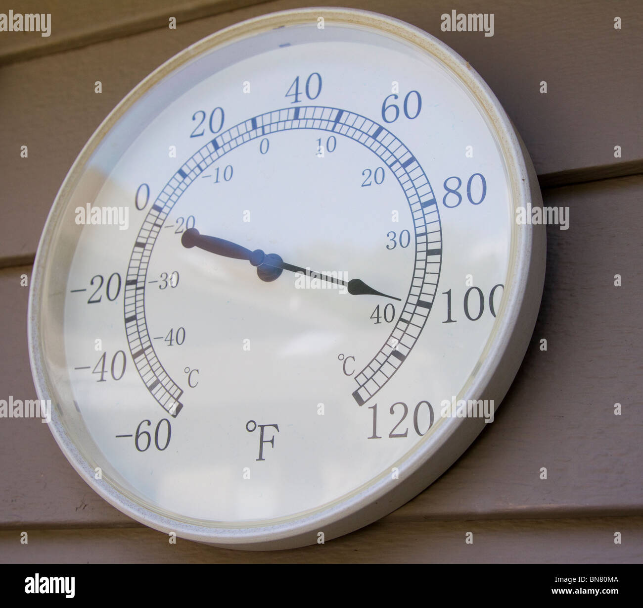 Outdoor thermometer showing 100 degree Fahrenheit temperature Stock Photo