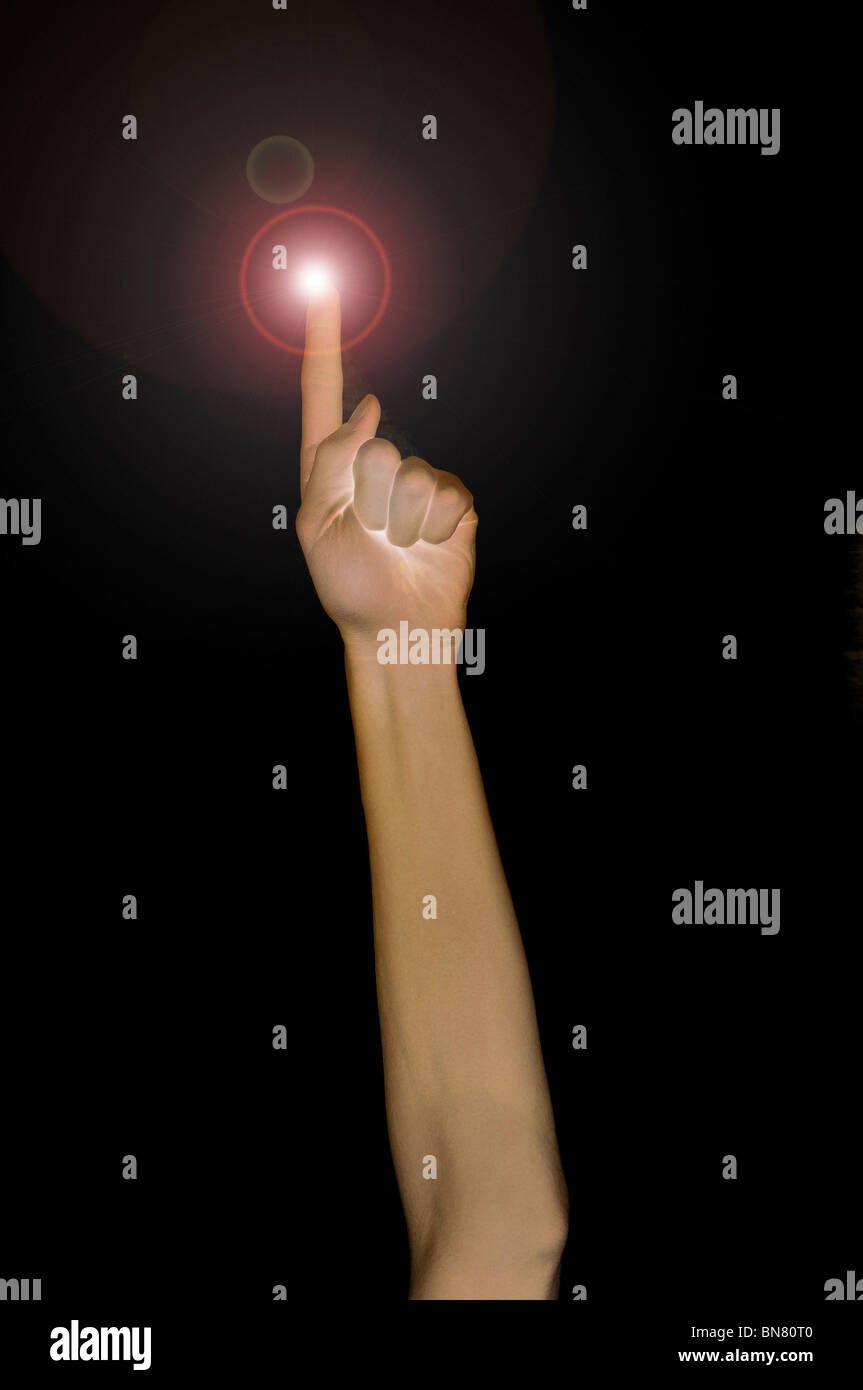 Pointing fingertip with light, pointing up. Stock Photo