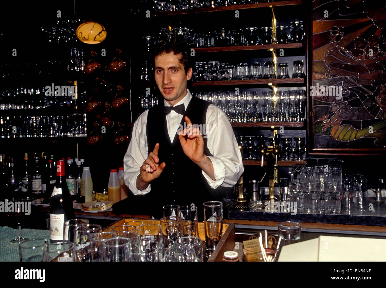 Belgian man, bartender, La Chaloupe d'Or, restaurant, De Gulden Boot, restaurant, GrandPlace, city of Brussels, Brussels Capital Region, Belgium Stock Photo