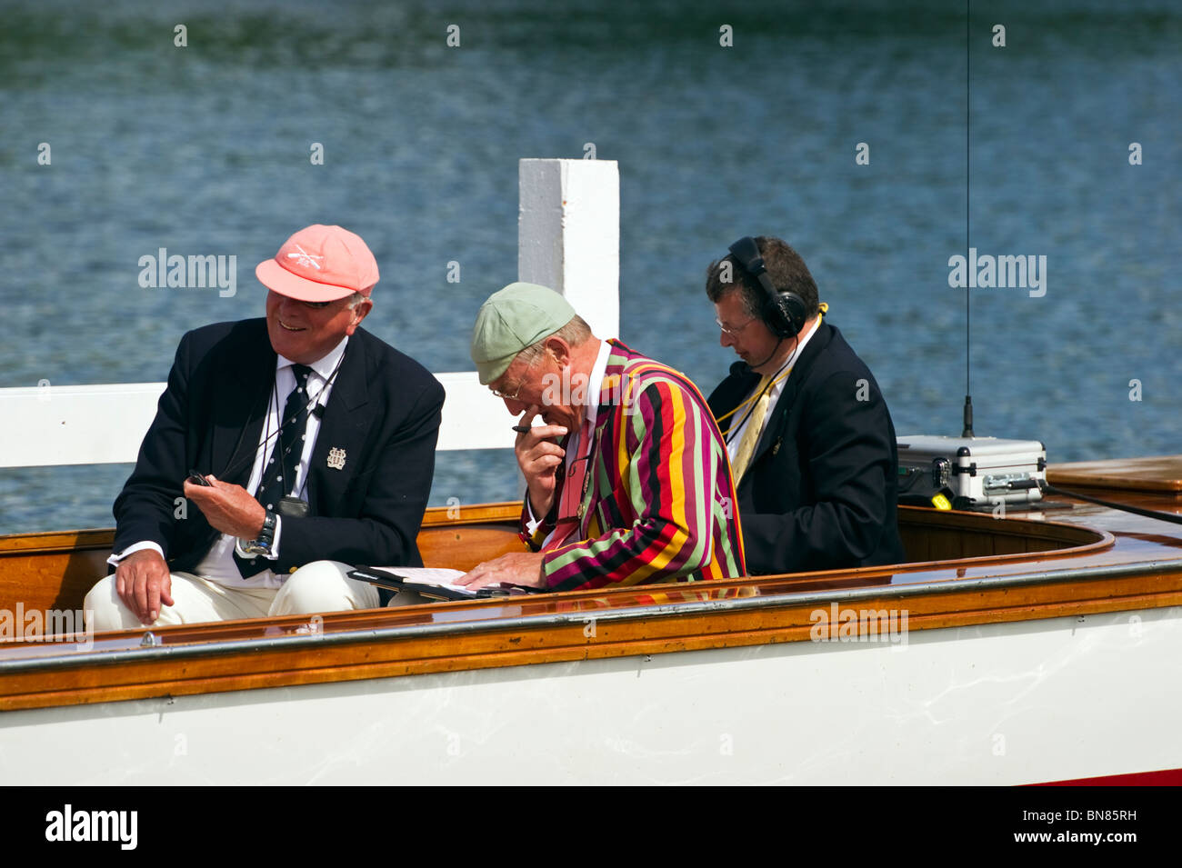 Umpires and officials consult just before the start of a race at Henley Royal Regatta a yearly event every UK Summer in July. Stock Photo