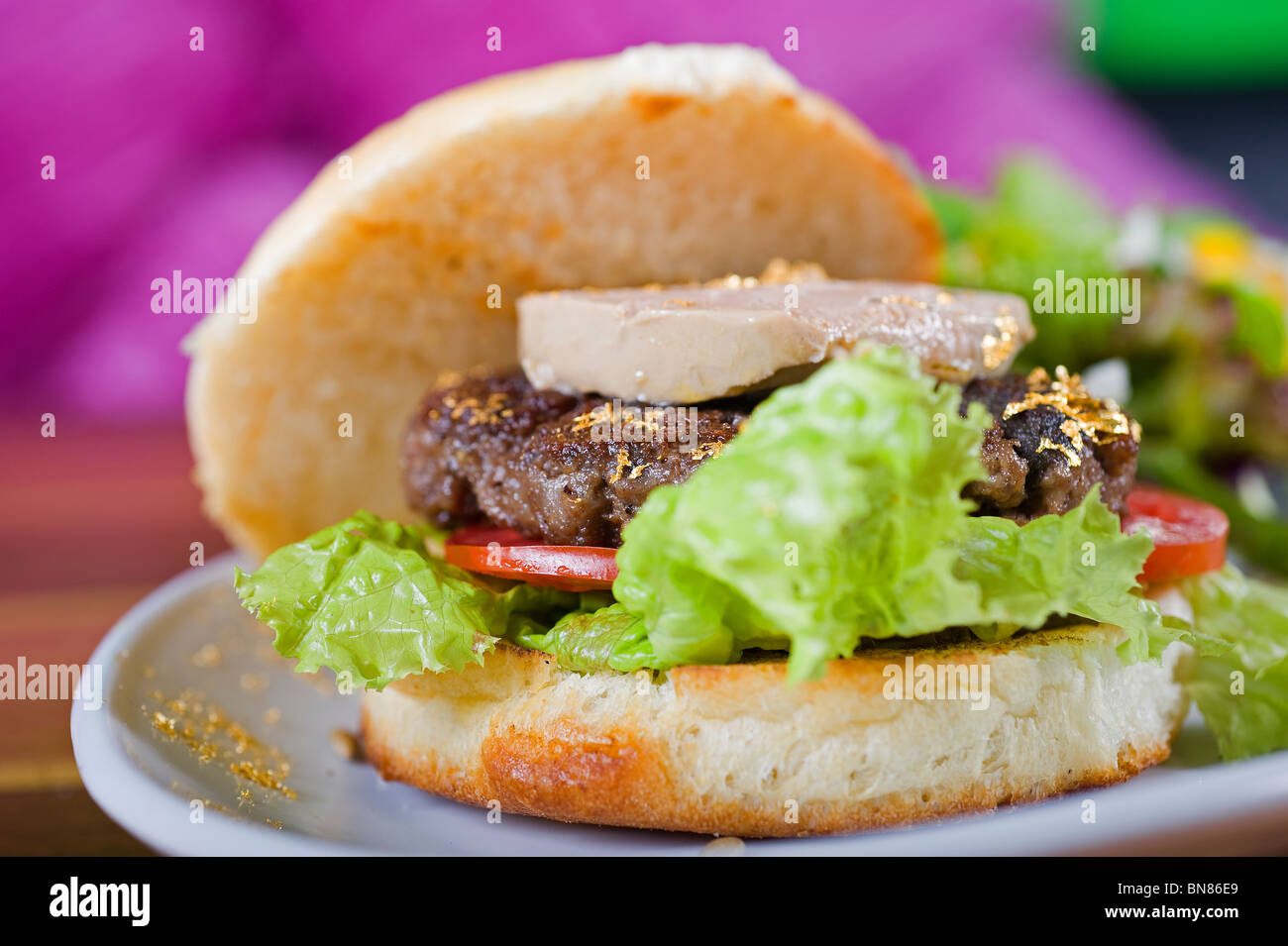 Gourmet beef burger with fois gras and gold leaf Stock Photo