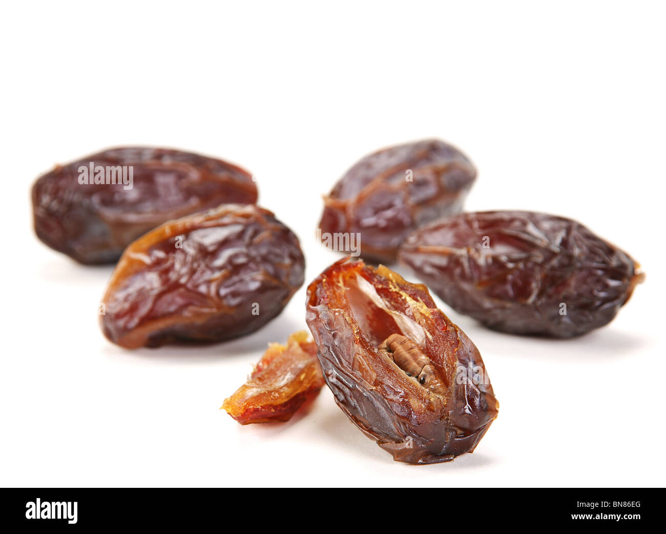 Big date dried fruit closeup on white background Stock Photo Alamy