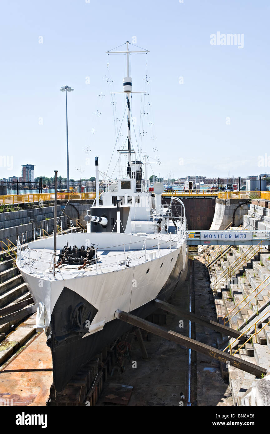 Former British Royal Navy Warship Type M29 Monitor M33 in Dry Dock at Portsmouth Historic Dockyard England United Kingdom UK Stock Photo