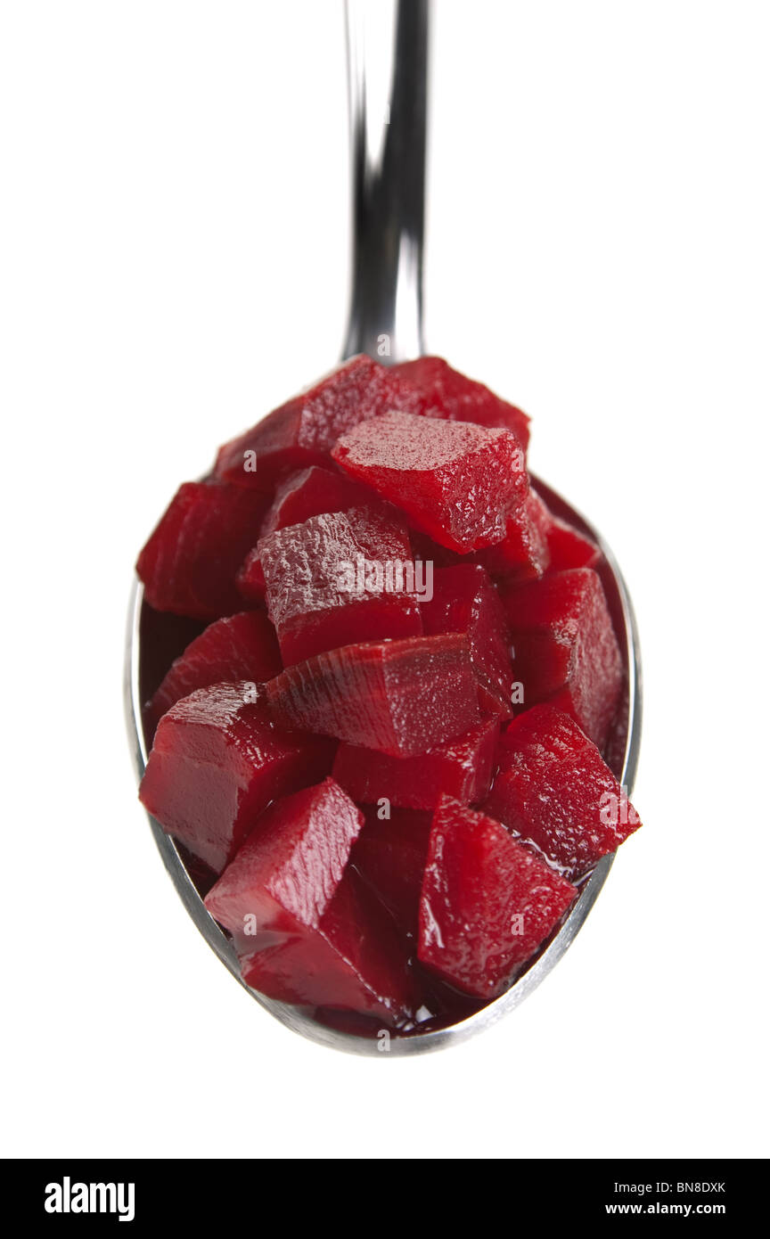 Beet slice preserved in metal spoon on white Stock Photo