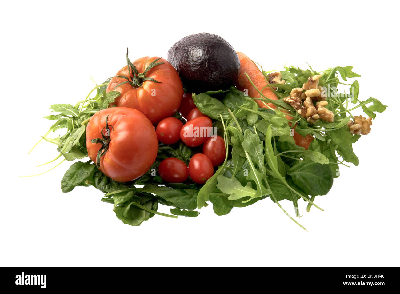 Fresh salad ingredients isolated against a white background. Stock Photo