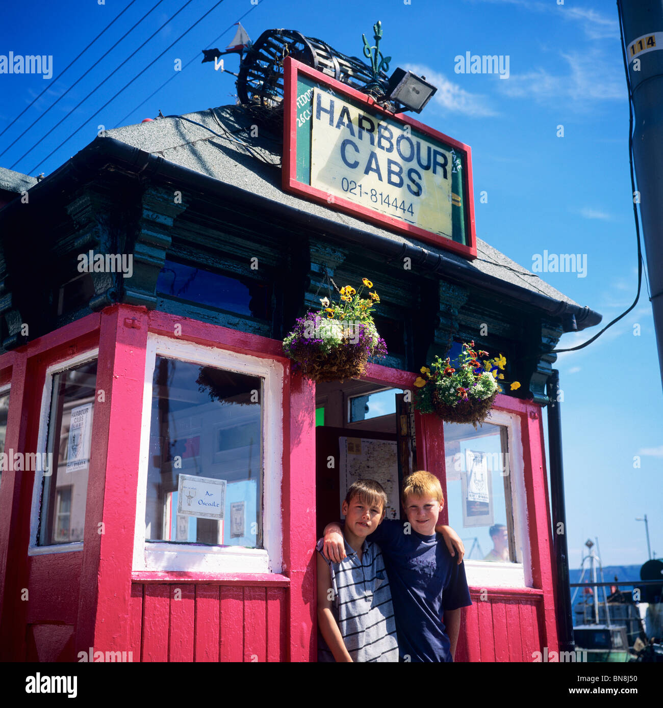 2 BOYS AT HARBOUR CABS CABMEN'S SHELTER COBH COUNTY CORK IRELAND Stock Photo Alamy