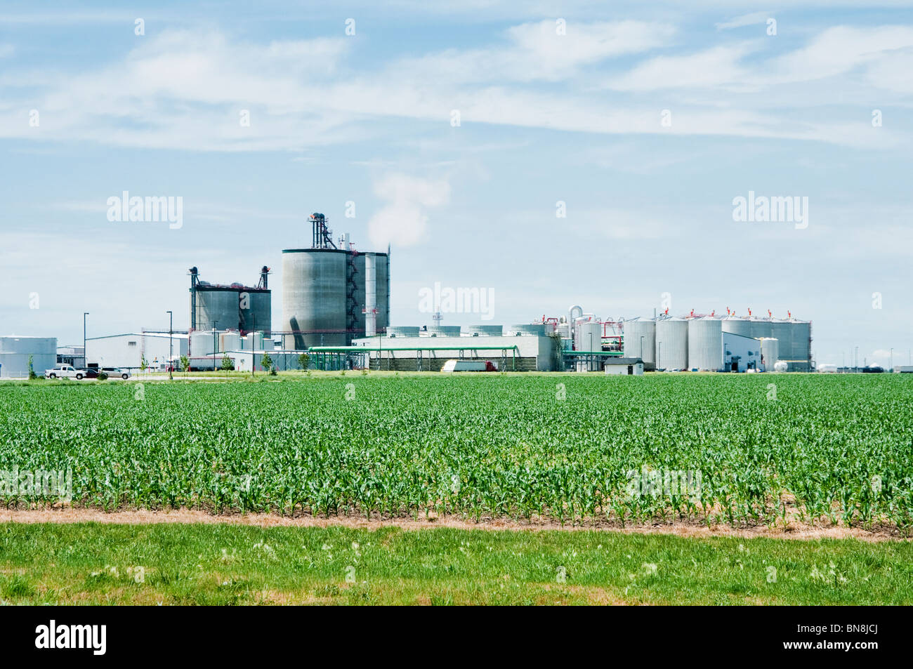 An ethanol processing plant in Nebraska with a corn field in the