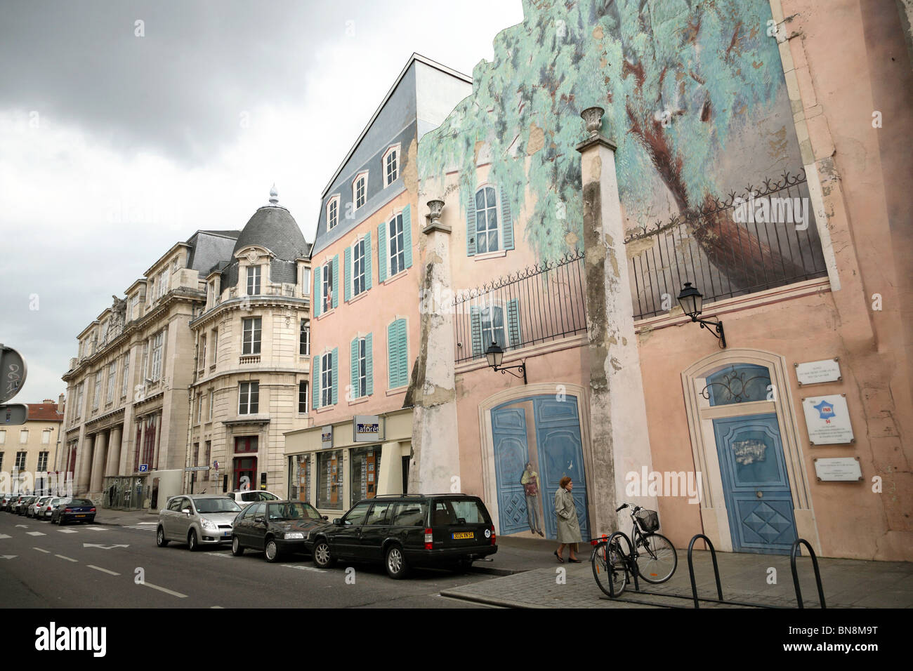 The facade of a windowless house with painted windows, Nancy, France Stock Photo