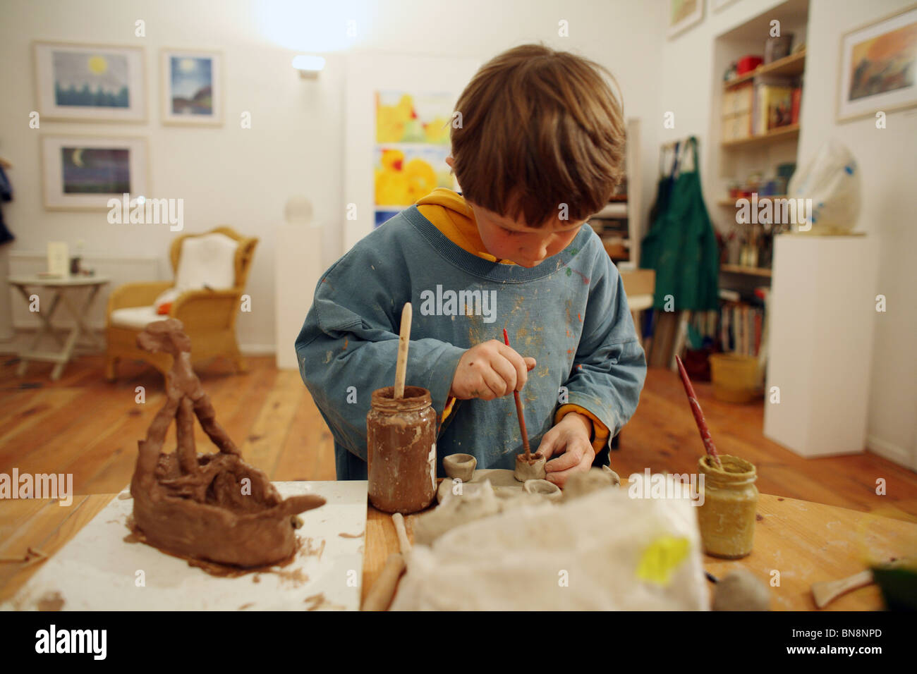 Boy making pottery Stock Photo