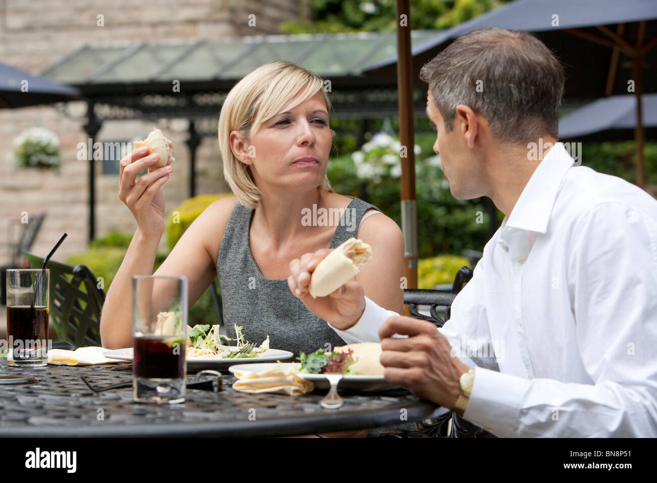 Couple lunching at hotel outdoors Stock Photo