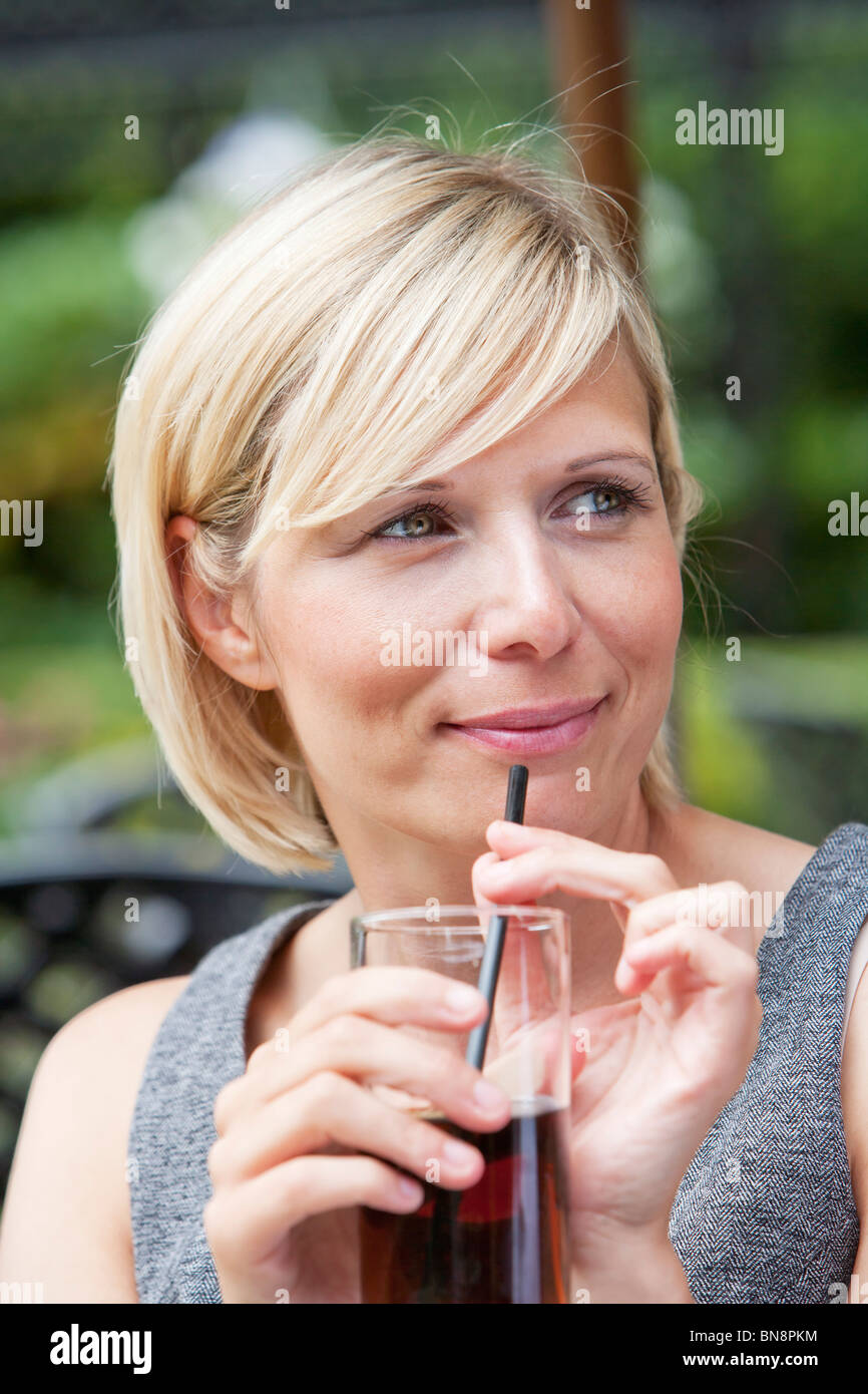 Young woman 30s with soft drink Stock Photo Alamy