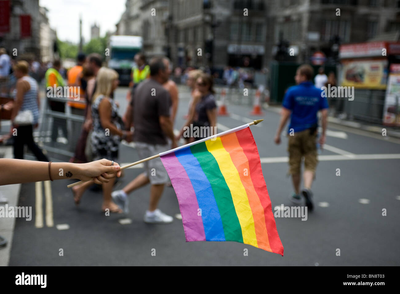 A Raibow flag held at the Pride London celebrations. Stock Photo