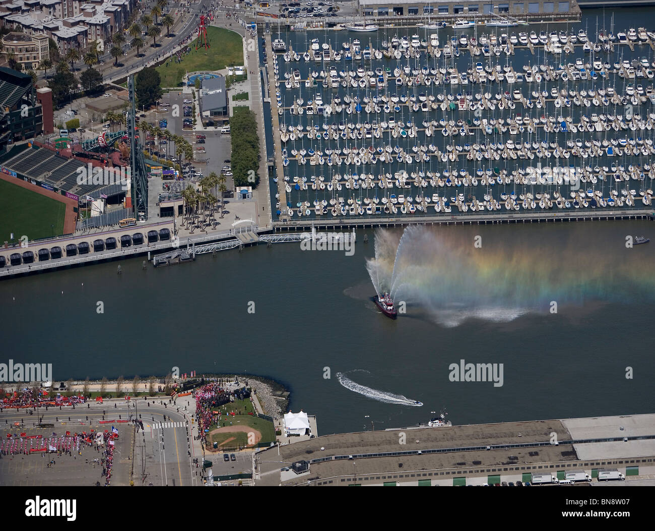 aerial view above Olympic torch relay ceremony fire boat McCovey Cove south beach harbor San Francisco California Stock Photo