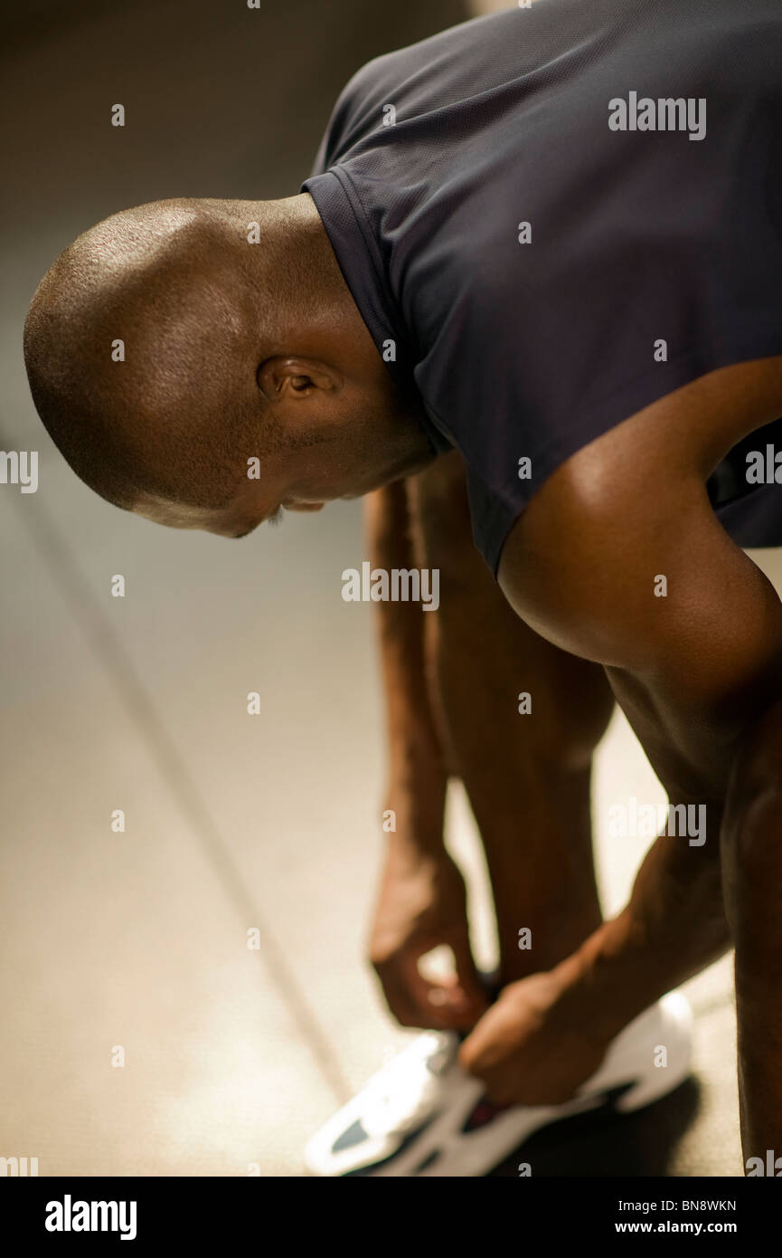Man tying his shoes Stock Photo