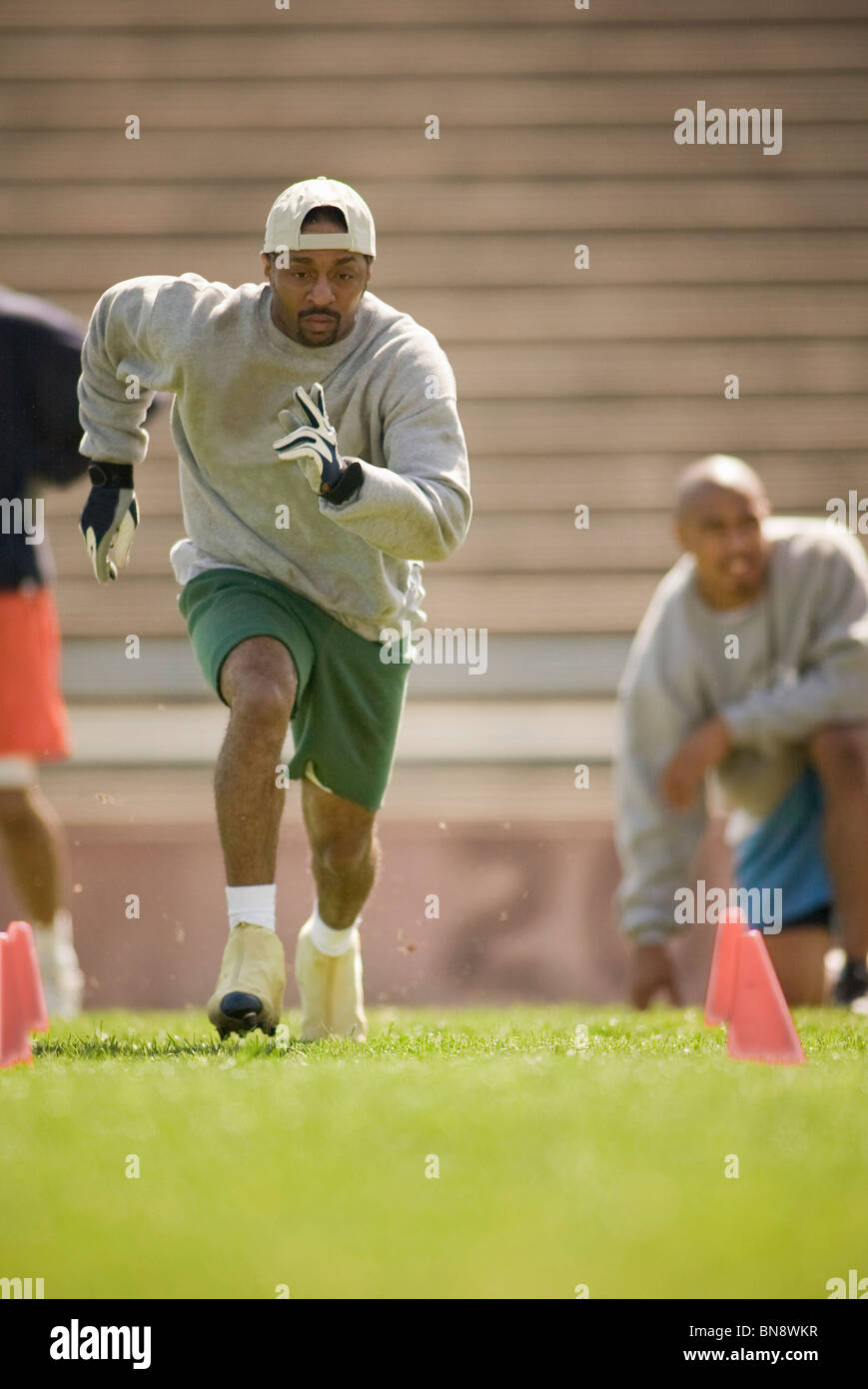 Men training on football field Stock Photo