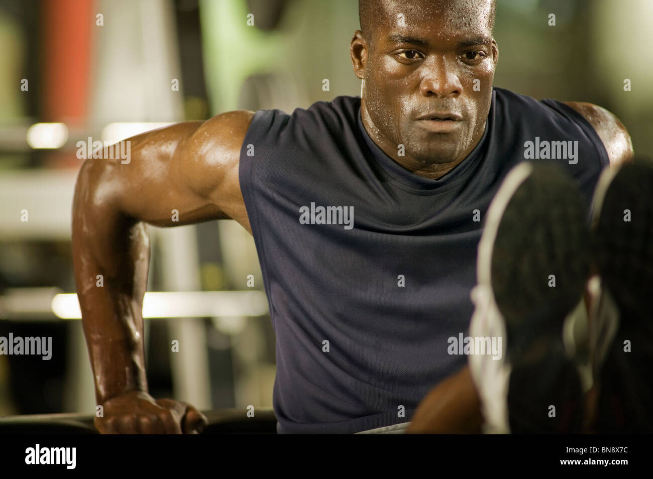 Man exercising in health club Stock Photo