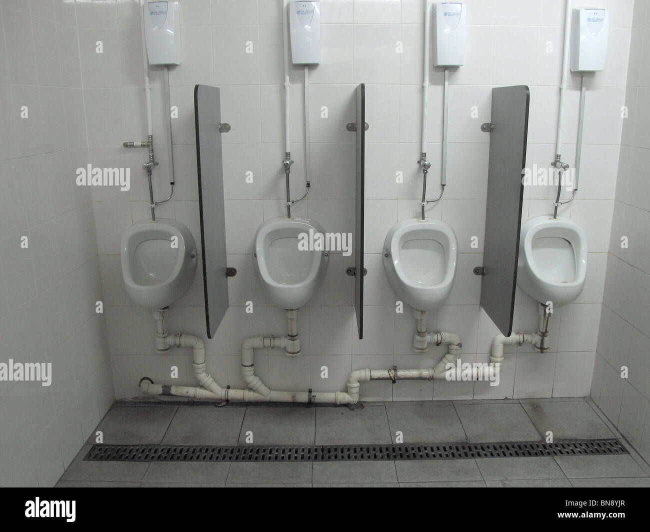 Mens Urinals in Portugal Public Toilets Stock Photo