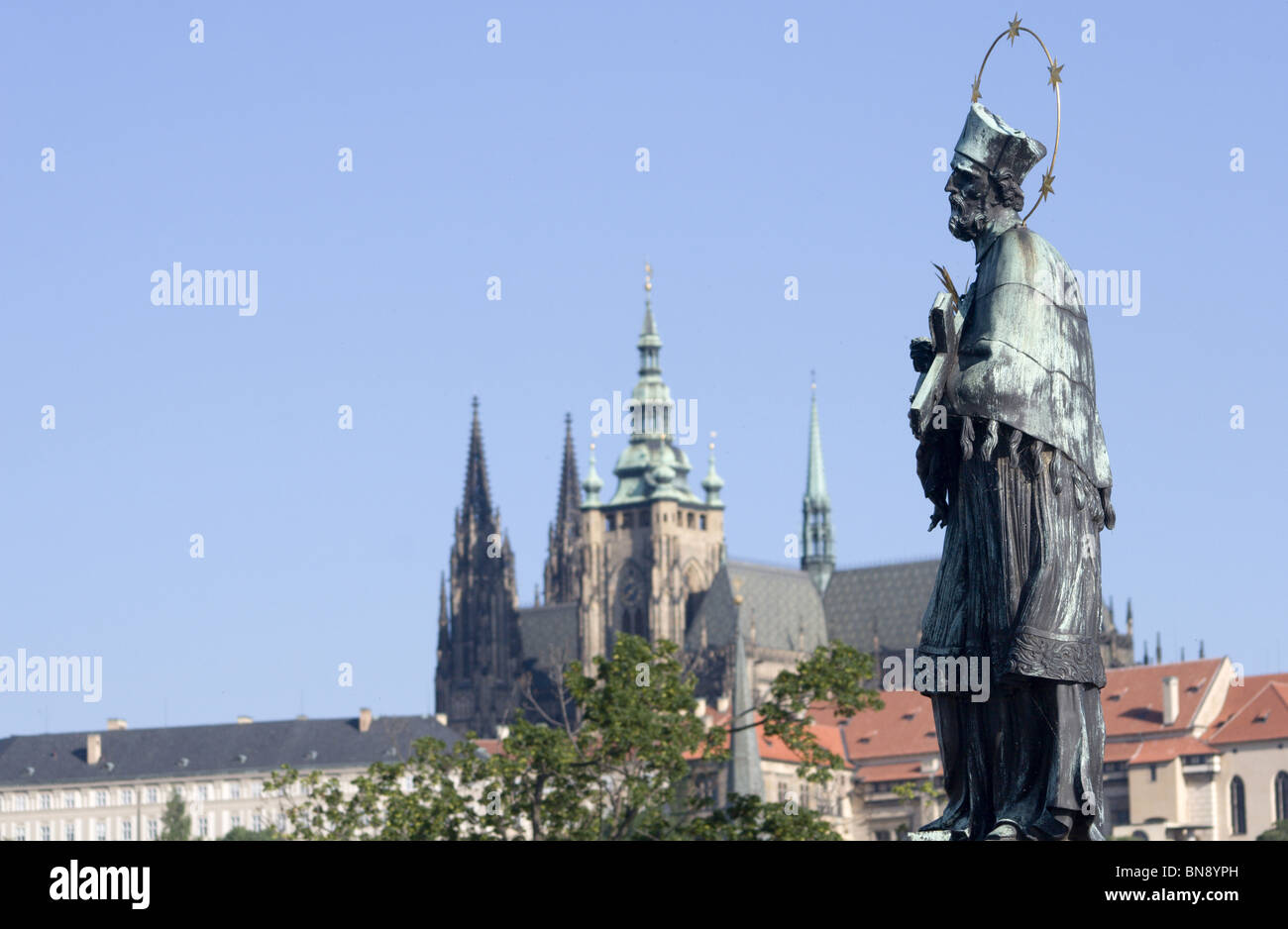 Prague - st. John Nepomuk from Charles bridge and st. Vitus cathedral Stock Photo