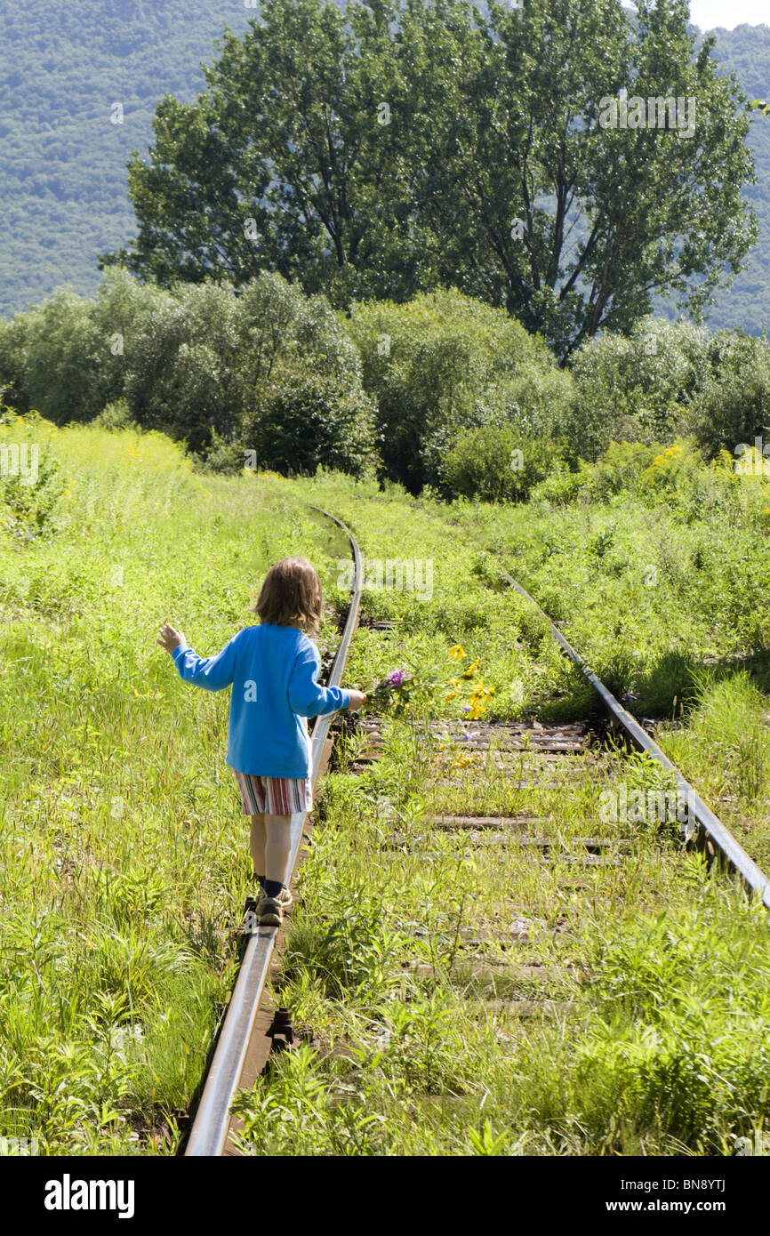 little girl on rails Stock Photo