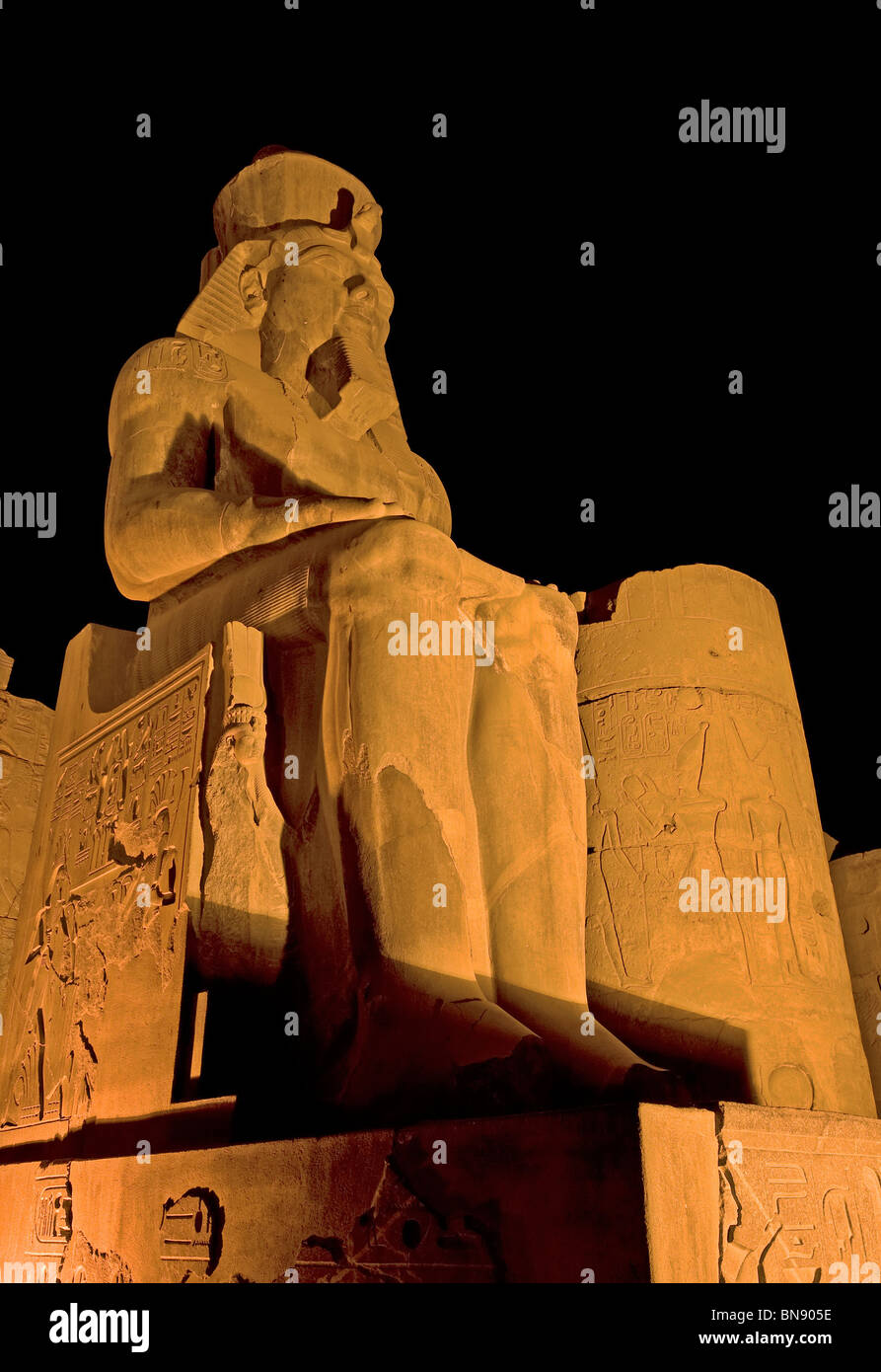 Statue of Ramses II at Luxor Temple at night Stock Photo - Alamy