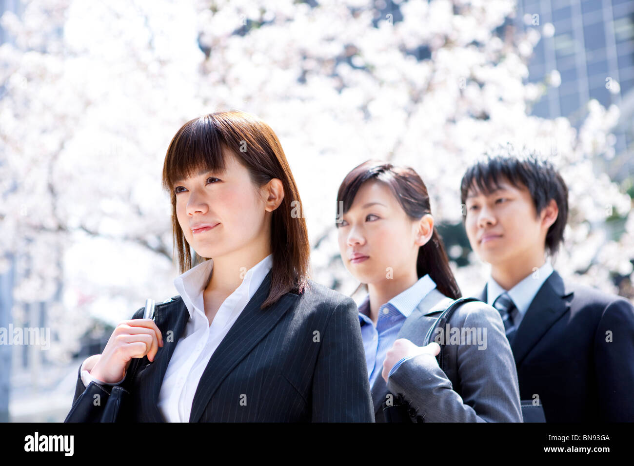 Three people standing in row hi-res stock photography and images - Alamy