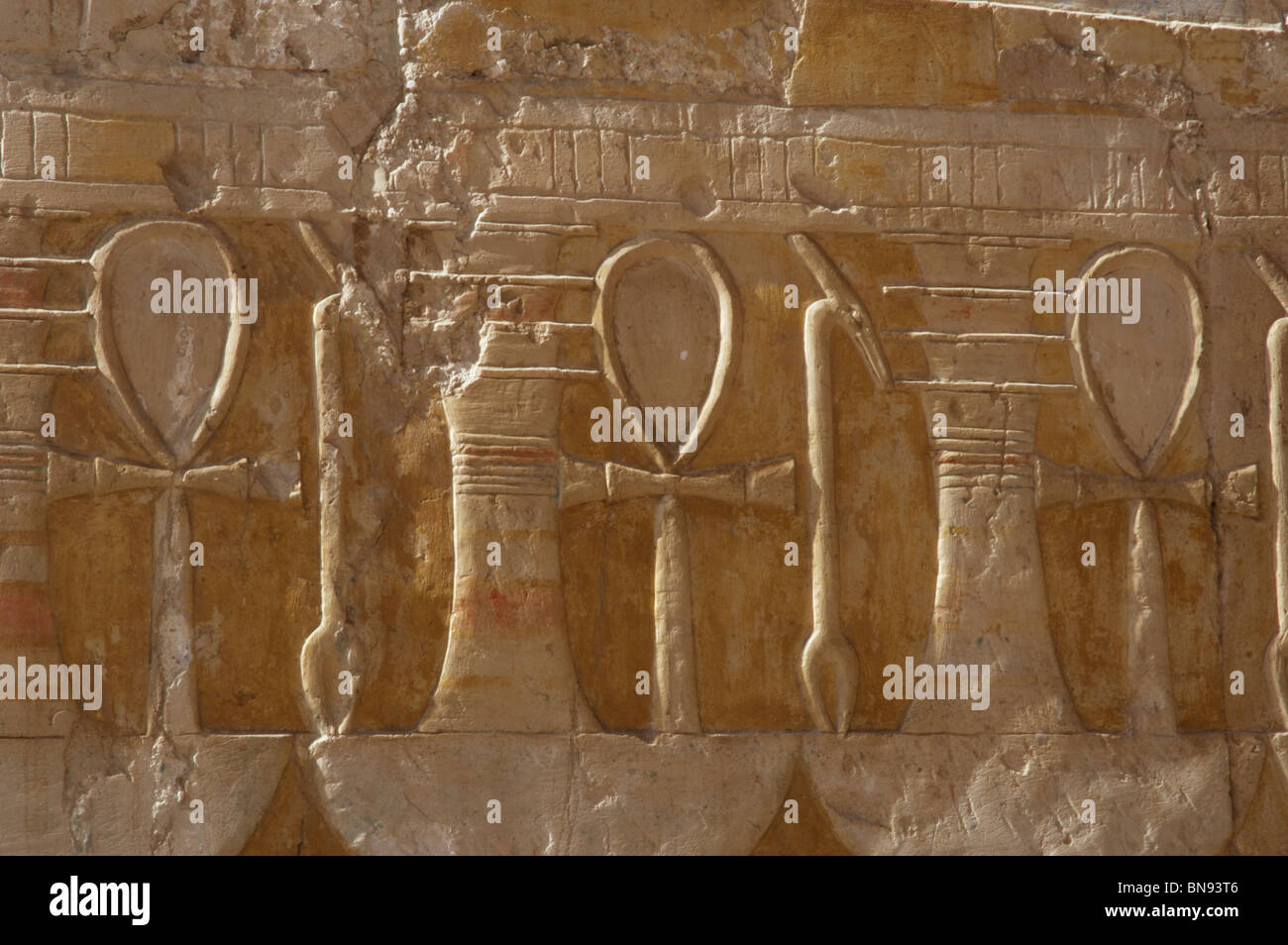 Reliefs depicting the ankh, uady, scepter linked to power and wealth and djed pillar. Temple of Hatshepsut. Egypt. Stock Photo