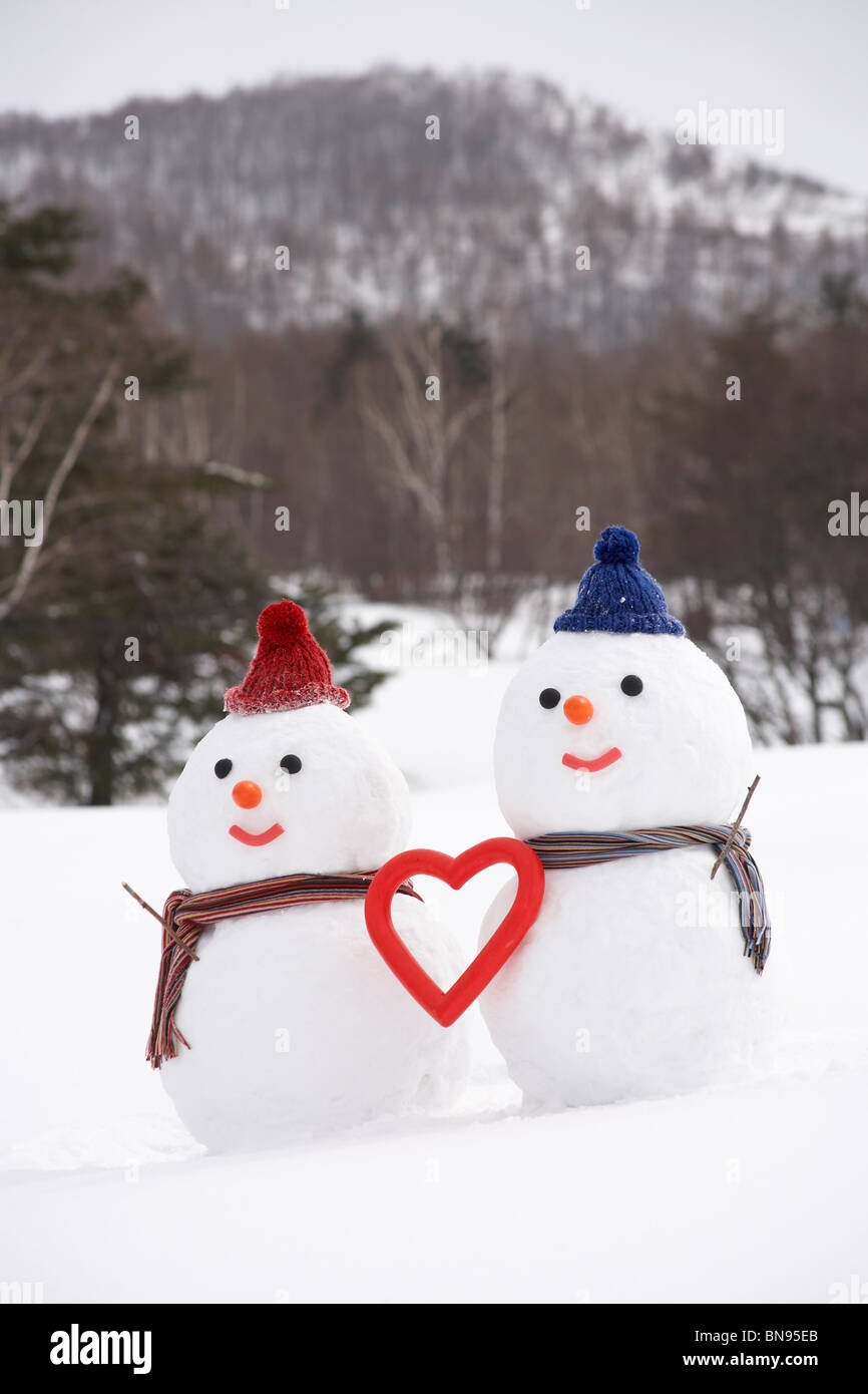 Snowman couple with heart shape, Yamagata Prefecture, Japan. Stock Photo