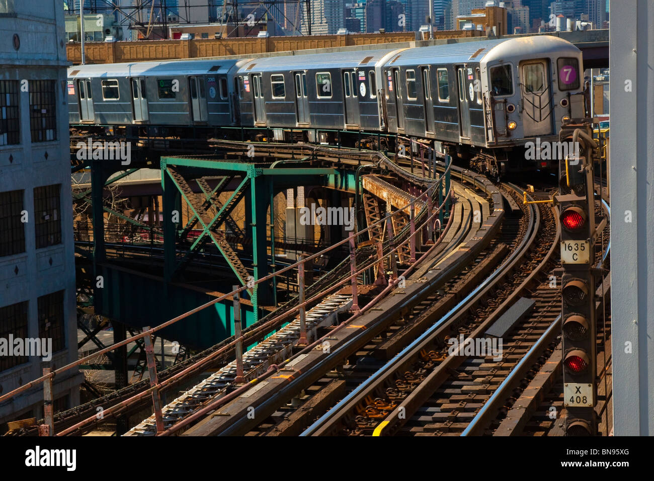 Train above ground on the 7 subway line in Queens, New York Stock Photo