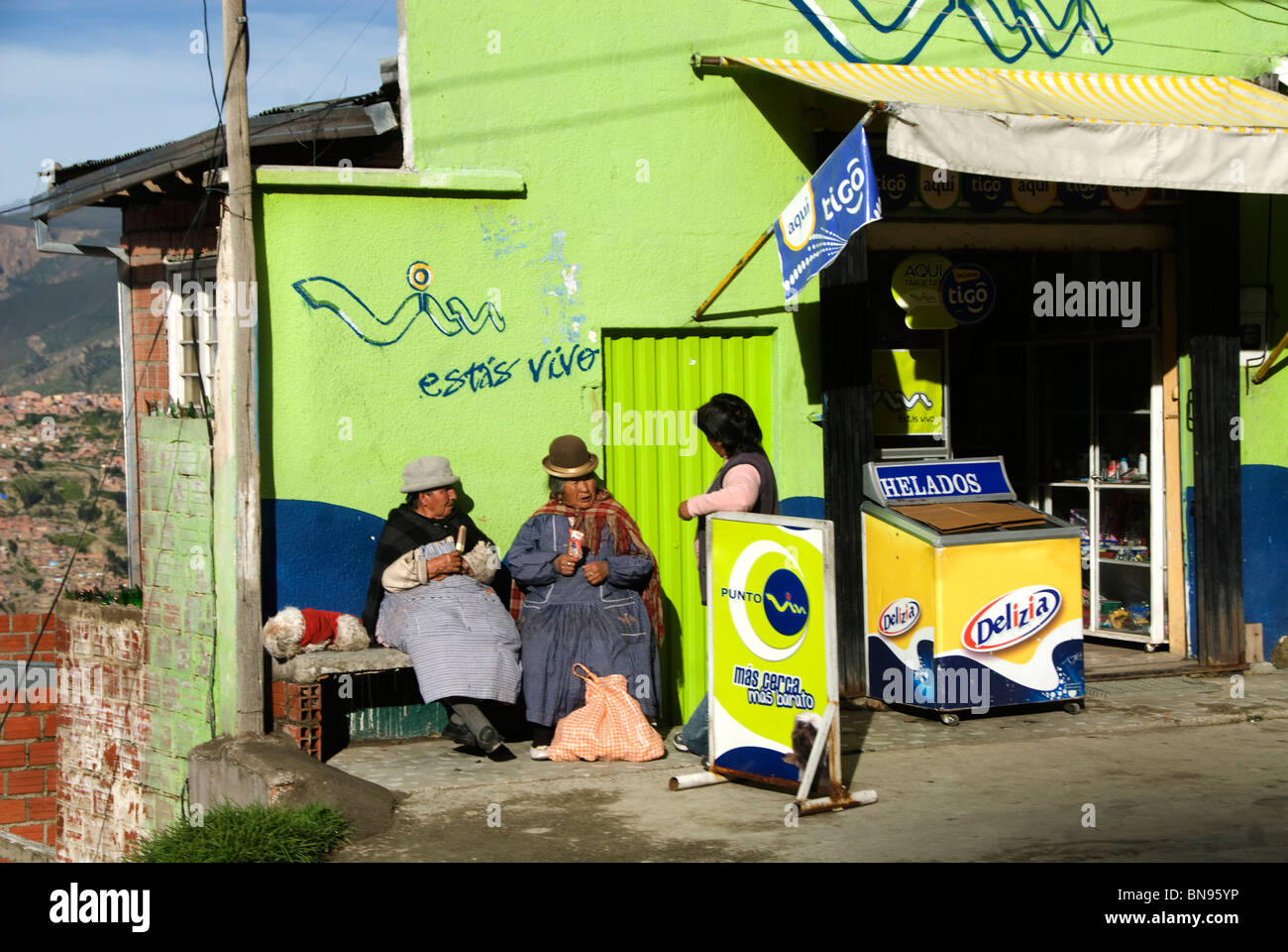 Older women sitting in the sun eating icecreams Stock Photo
