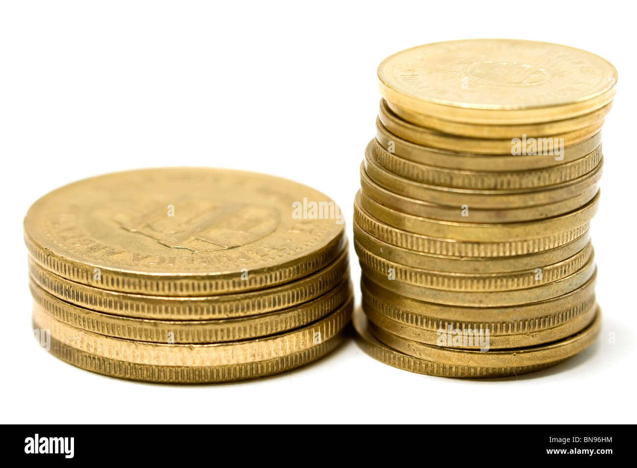 Golden argentine coins stack over white background Stock Photo