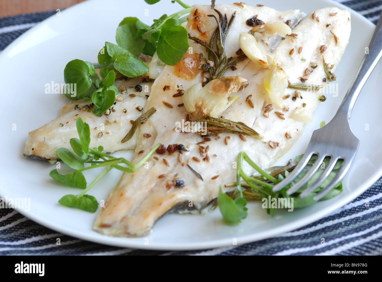 Sea bass fillets with watercress Stock Photo
