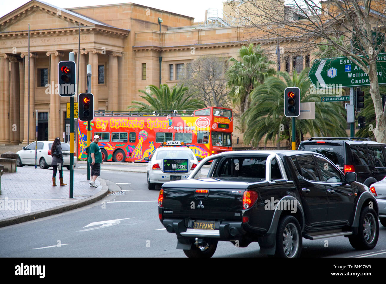sydney explorer sightseeing bus travels past NSW State library,sydney,australia Stock Photo