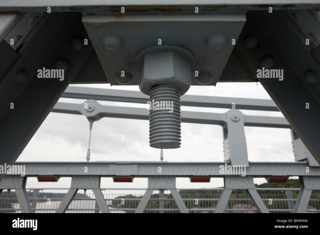 Closeup of large nut and bolt holding chain links of Telford's